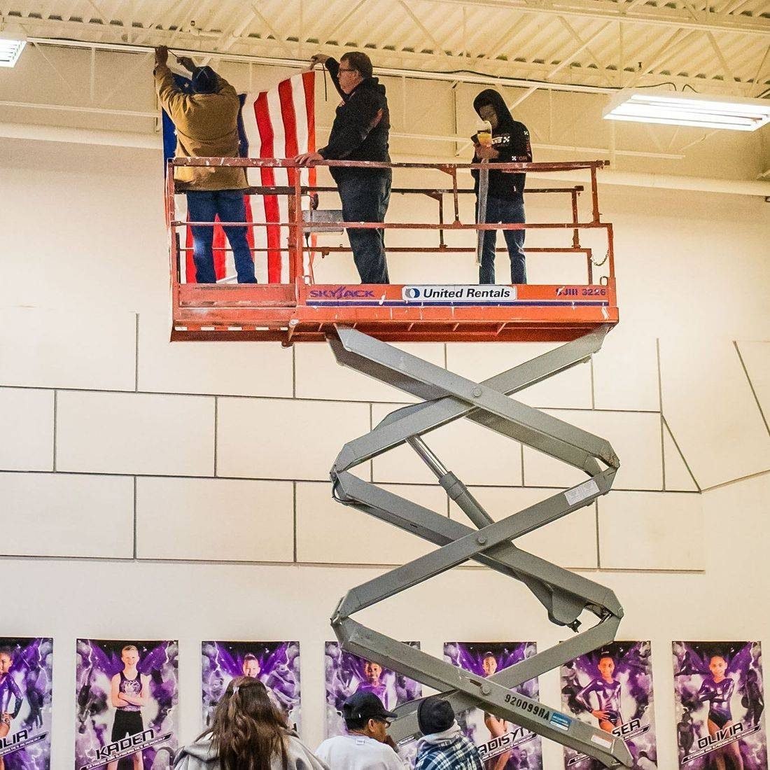 Hanging the flag in the new gym