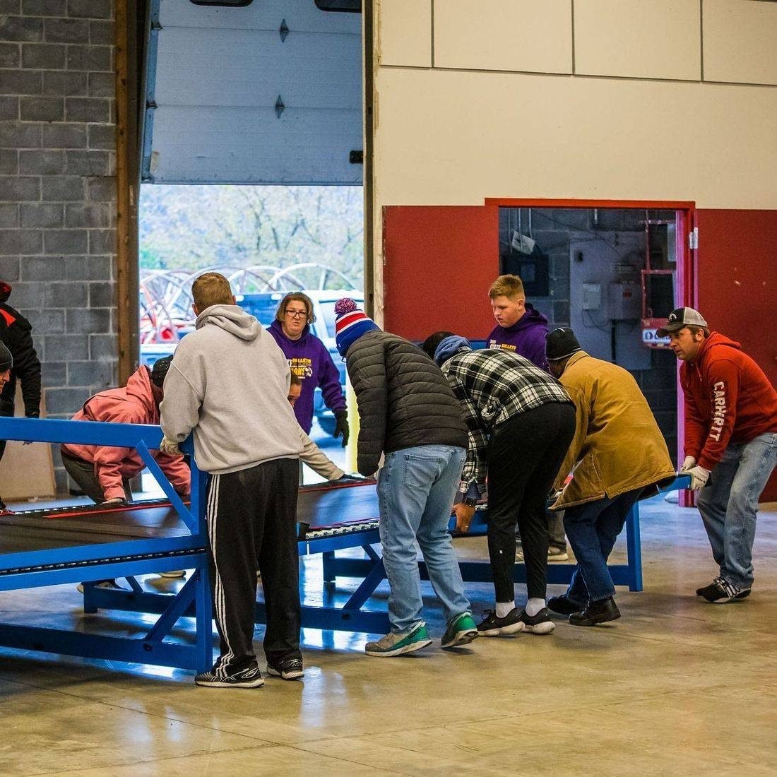 Families helping set up the gym